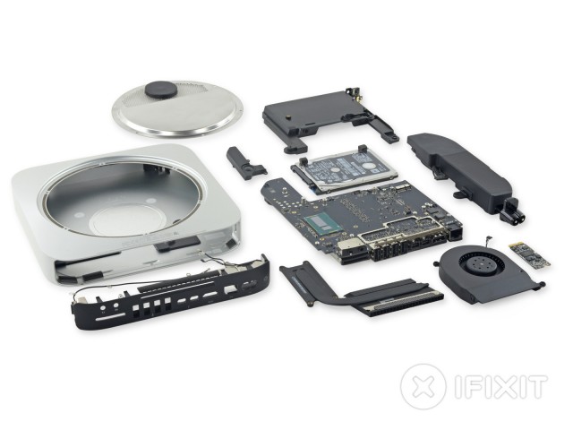 photo of iFixit’s 2014 Mac Mini teardown shows a sealed, less-upgradeable redesign image