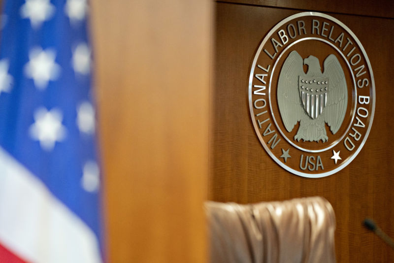The National Labor Relations Board (NLRB) seal hangs inside a hearing room at the headquarters in Washington, D.C.
