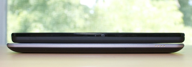 A Kindle Fire stacked on top of the Nexus 7.