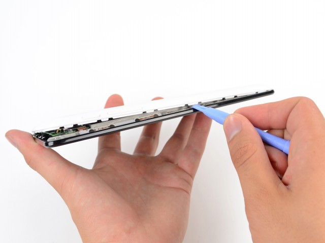 iFixit opened up the Nexus using one of its trusty plastic opening tools.