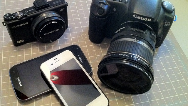 Clockwise from top left: Olympus XZ-1 point and shoot, Canon 20D DSLR with EF-S 10-22mm lens, iPhone 4S, Samsung Galaxy SII. Photo taken with an iPhone 4.