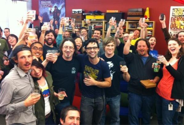 The Double Fine team celebrates becoming only the second project in Kickstarter history to bring in over $1 million/