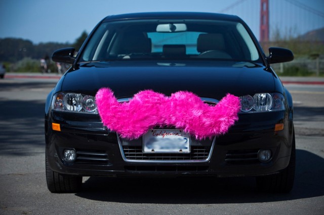 Lyft drivers sport "carstaches" on their vehicles while on duty.