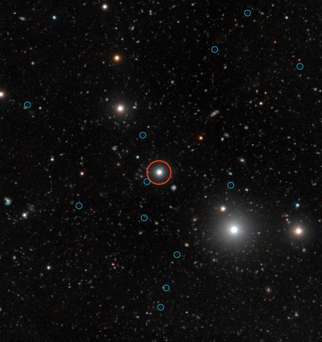 Ultraviolet light from a quasar (in the red circle) causes hydrogen gas in dark galaxies (blue circles) to fluoresce.