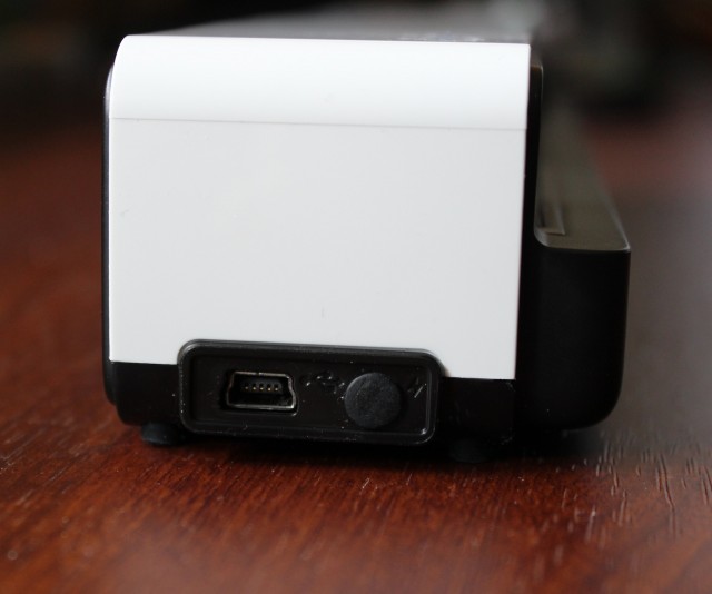 The Go keeps its mini USB port on its left side. The rubber stopper to its right protects the jack for the optional international power adapter accessory.