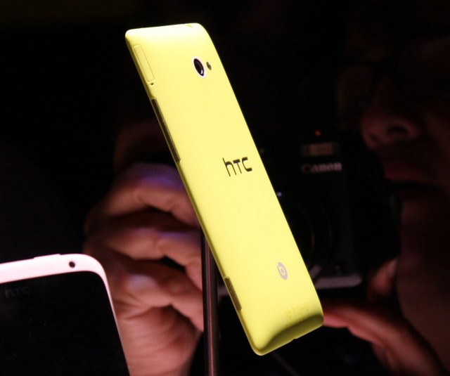 An HTC 8X, cast in "limelight yellow" polycarbonate.
