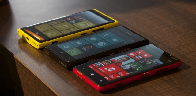 A yellow Lumia 920, black Lumia 900, and red Lumia 820