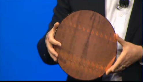 Intel Chief Technology Officer Justin Rattner holds a wafer of Rosepoint system-on-a-chip dies. Each die has two Atom cores and a full WiFi transceiver.