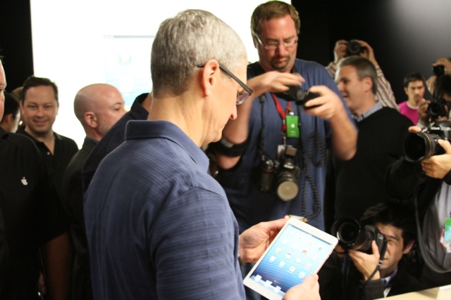 Tim Cook demoing the white iPad mini.