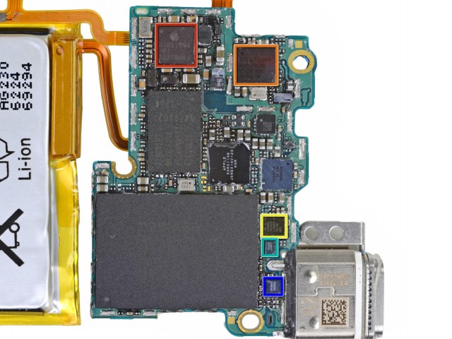 The massive chip is a 16GB Toshiba NAND flash, and the rectangular chip is an NXP ARM-based system-on-a-chip.