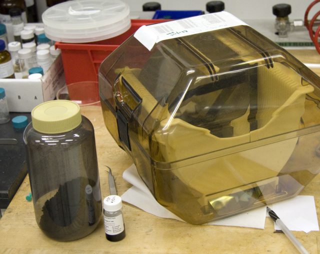 The present and future? A collection of silicon wafers (case) sits next to a bottle of carbon nanotubes, purchased from a supplier.