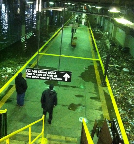 A subway station, with tracks submerged. 
