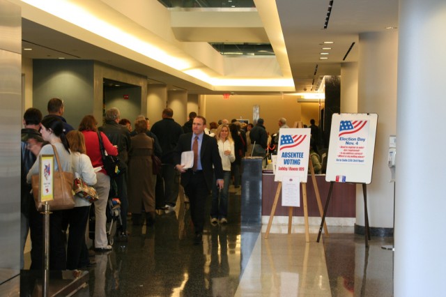 Voters stand in an early voting line in Arlington, VA.