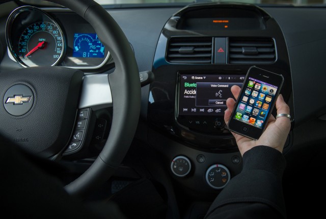 Chevy's 2013 Spark and Sonic compact cars will let drivers ask Siri to perform simple tasks while keeping their eyes on the road and hands on the wheel.