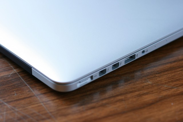 On the left side, the 13" Retina MacBook Pro has a MagSafe 2 connector, two Thunderbolt ports, a USB 3.0 port, and an audio out jack.