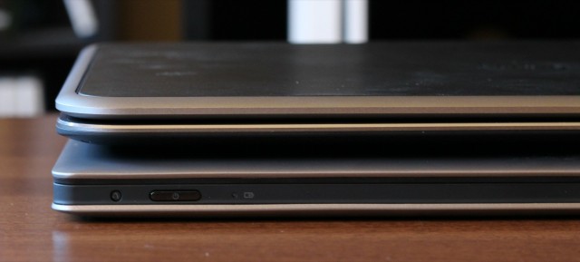 Despite its 12.5-inch screen, the XPS 12 is similar in thickness and weight to larger 13-inch Ultrabooks like the Lenovo IdeaPad Yoga (bottom).