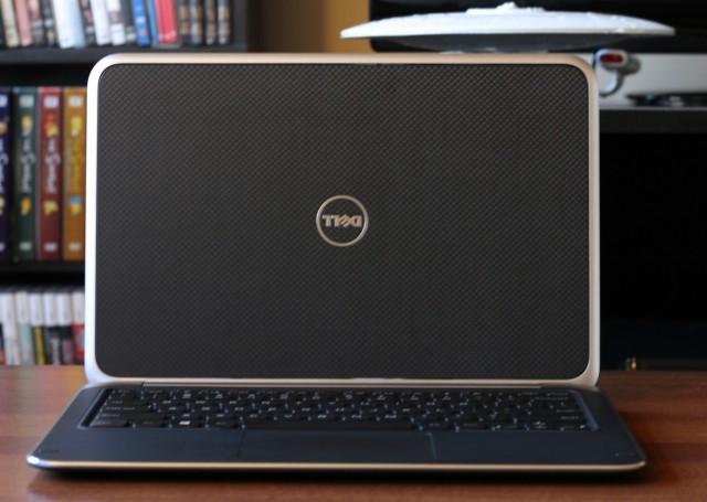 The laptop's lid (shown here flipped) uses a slightly rubberized checkerboard texture.