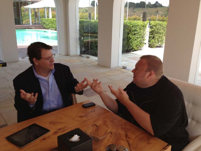 Dotcom discussing last-minute tweaks to Mega with his lawyer Ira Rothken.