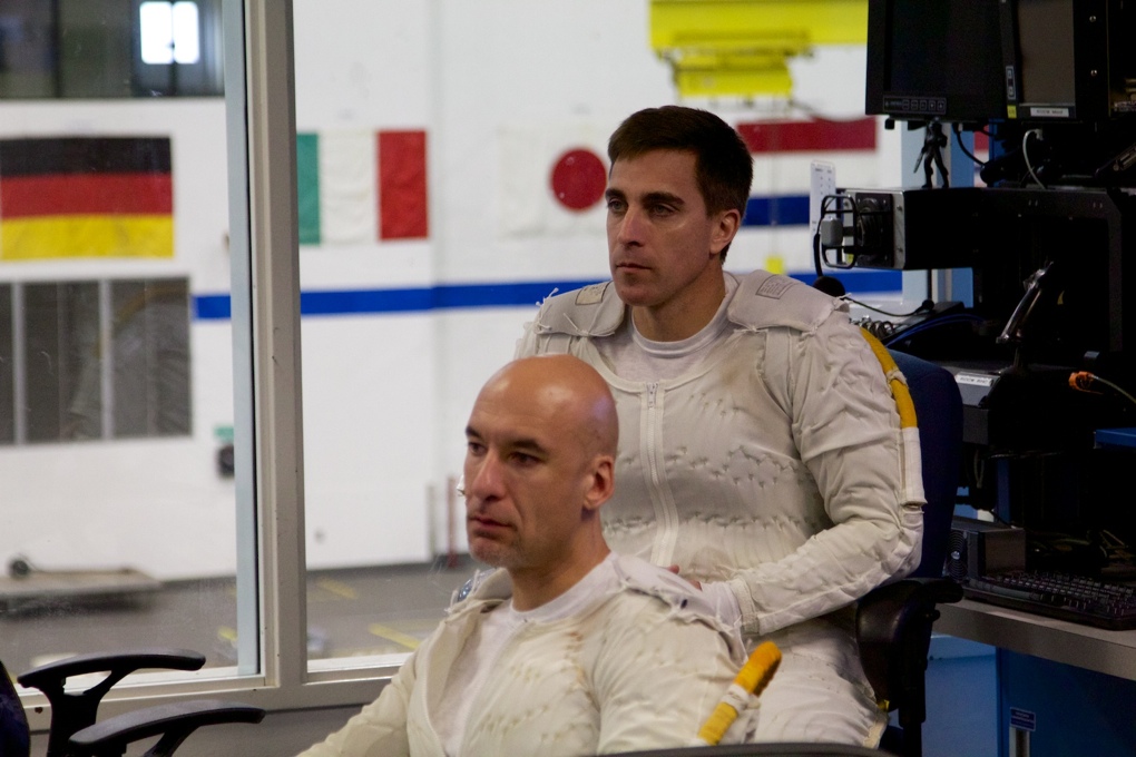 Luca Parmitano and Chris Cassidy, following along with the dive briefing.
