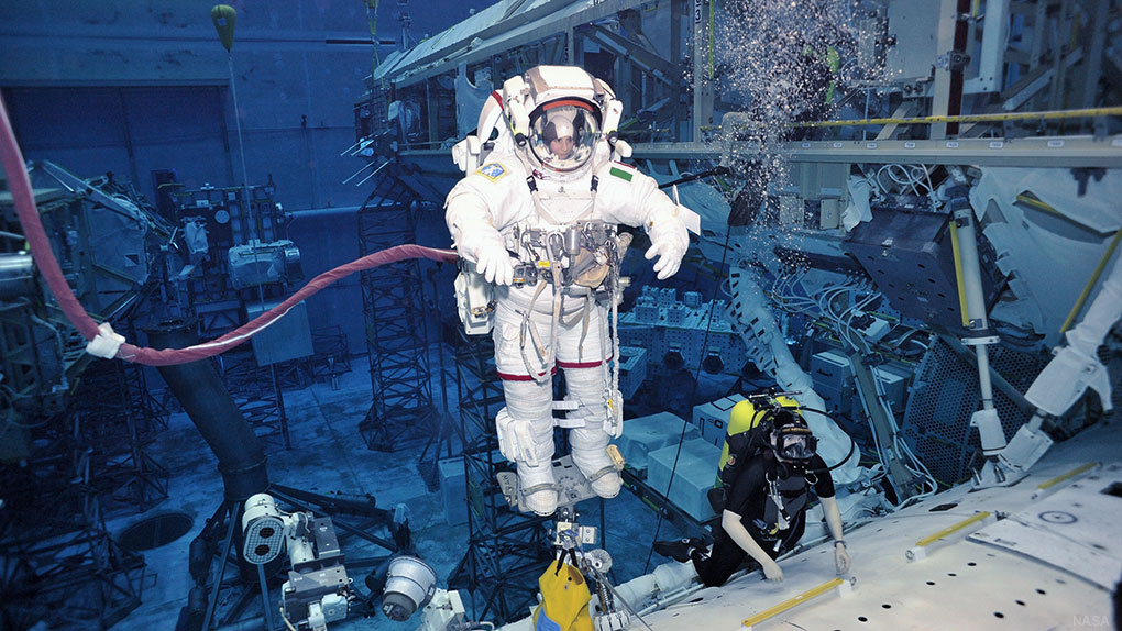 Samantha Cristoforetti, an astronaut with the European Space Agency, performing an exercise in the pool with the body restraint tether. (Photo courtesy of NASA)