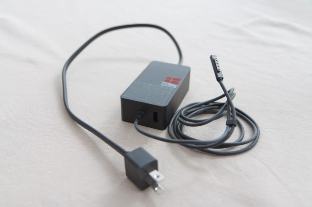 A Surface Pro's power brick and cable.