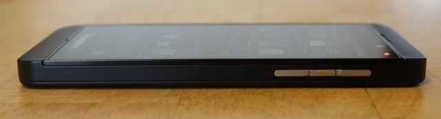 The volume rocker and play/pause/voice control button are on the right edge.