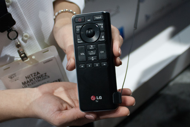 The front side of a Google TV remote for an LG TV. Buttons are pared down from a normal remote, even though interactions are more complex, which is commendable.