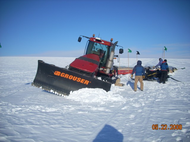 A GrIT towing tractor ensnared by a crevasse.
