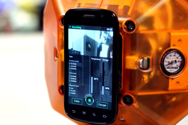 The Nexus S runs an app that records activity on the gyroscope, accelerometer, and 3D compass. 