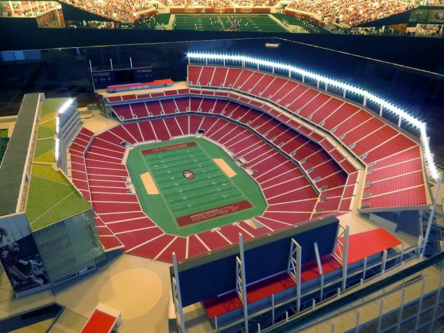 A model of Santa Clara Stadium, with a wall painting visible in the background.