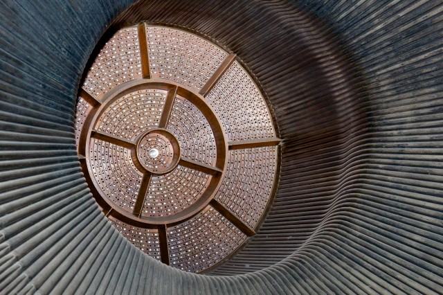 Detail on an F-1 engine injector plate at the forward end of the nozzle. Fuel and liquid oxygen are sprayed out of these holes under tremendous pressure, with each ring alternating propellant and oxidizer.  Photo is from F-1 engine number F-6045, on public display at the US Space and Rocket Center in Huntsville.