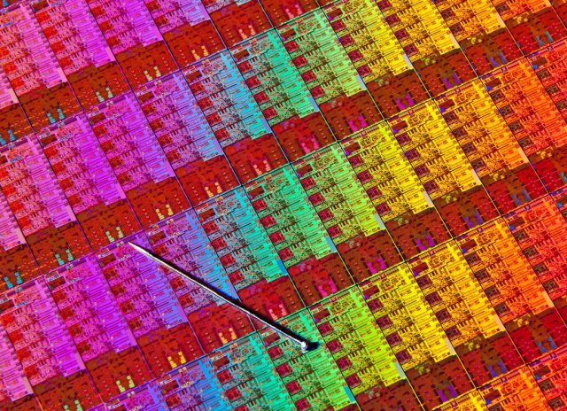 A closeup shot of an Intel Haswell die, with a pin for size reference.