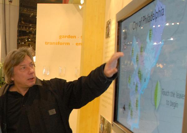 Slavko Milekic shows his touchscreen at the 2008 Philadelphia Flower Show.