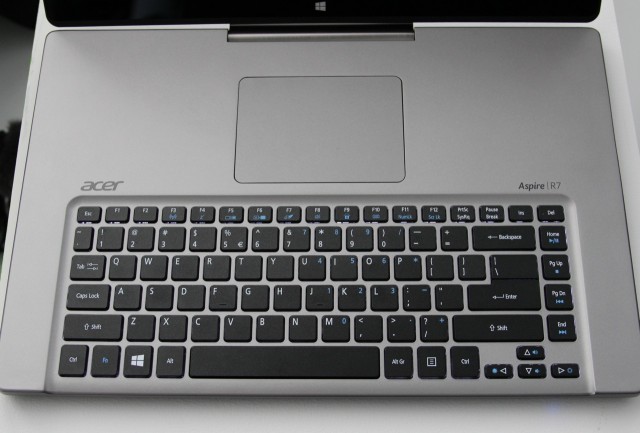 No, you're not tripping: the R7 reverses the conventional positioning of the keyboard and trackpad. 