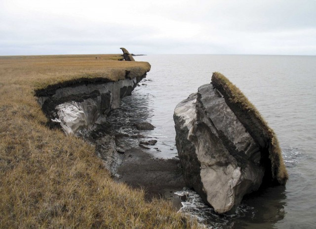 Some Alaskan permafrost tumbles into the ocean.