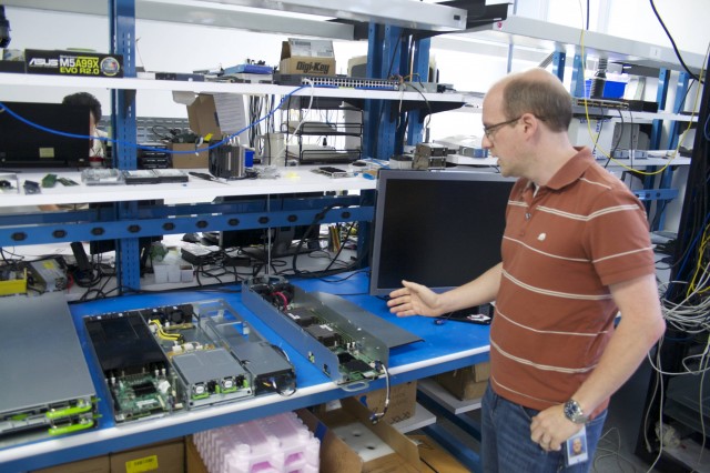 Facebook's Senior Manager of Hardware Engineering Matt Corddry shows off some of the "sled" servers designed and built by Facebook.