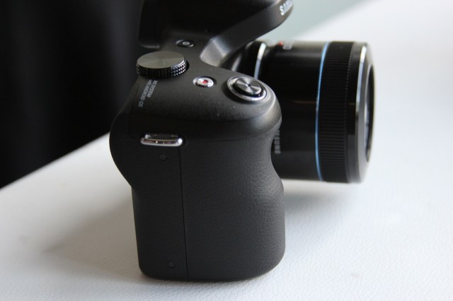 The Galaxy NX has a nice rubberized handle and the requisite camera loops (one on each side) to keep you from dropping it.