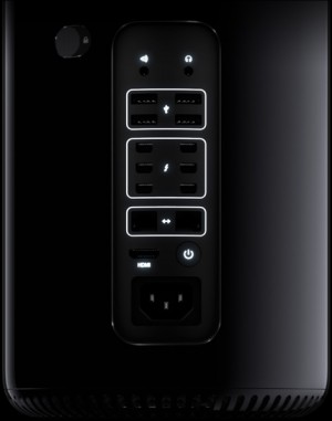The Mac Pro's expansion ports. Six Thunderbolt 2 ports are at center.