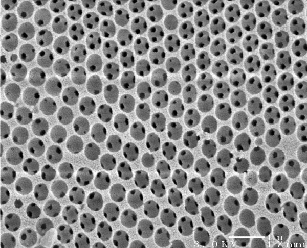 Silicon-based photonic crystal, full of holes to trap modes of light.