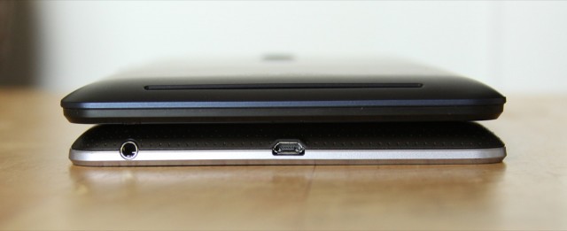 The 2012 Nexus 7 (bottom) keeps its USB port and headphone jack on the bottom of the tablet...