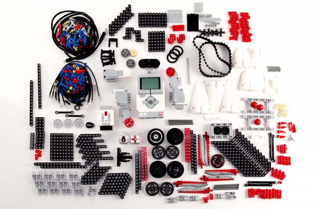 All 594 components of the EV3 set, meticulously arranged on my living room floor. Actually, on a large piece of poster board on my living room floor.