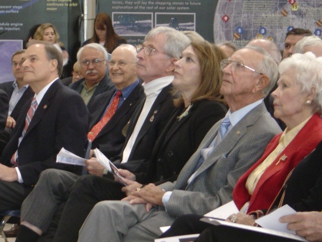 Kraft and his wife at the Saturn V exhibit opening in 2007. Also visible in the image are moon walkers John Young (white turtleneck) and Al Bean (red tie).
