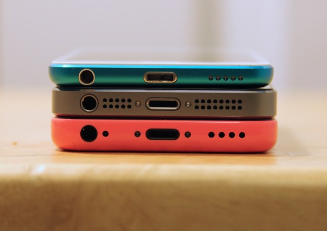 The iPhone 5C, iPhone 5S, and fifth-generation iPod touch stacked on top of one another.