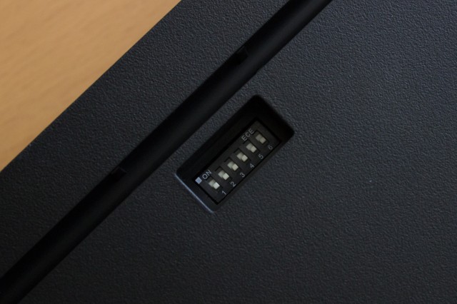 The DIP switches embedded in the back of the keyboard. 