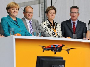 German Chancellor Angela Merkel smiles as a Parrot AR drone comes in for a crash landing during a Christian Democratic Party campaign event September 15.