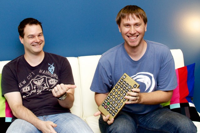 SnapStream president Aaron Thompson at left, and SnapStream director of engineering Jason Baumeister at right. The giant remote is real and I need one.