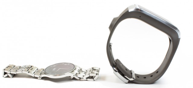 The stiff, supportive band of the Galaxy Gear stops it from resting on a wrist like a normal watch.