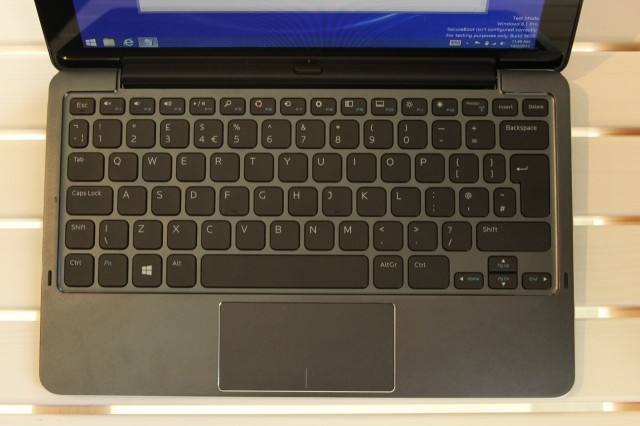 The "Mobile Keyboard" accessory transforms the tablet into a small laptop. Press the button in the middle of the dock to remove the tablet from the dock.