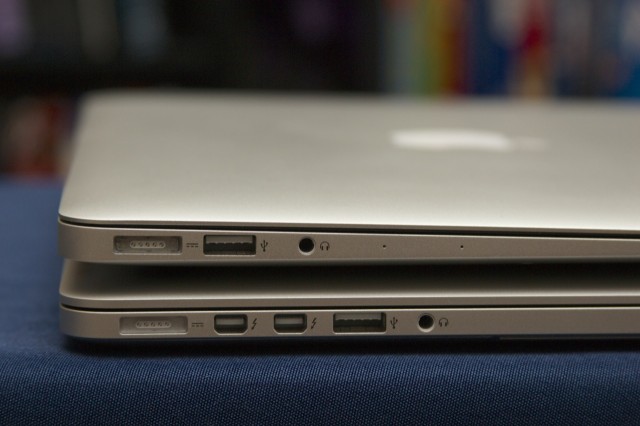 The Retina MacBook Pro (bottom) picks up a second Thunderbolt port that the MacBook Air doesn't have.