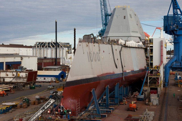 The USS Zumwalt getting a coat of paint at Bath Iron Works. The ship is exotic in many ways, but it runs on off-the-shelf computing technology. It also costs nearly $4 billion.